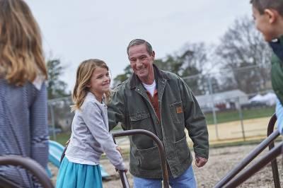 Temple patient, Ralph, at the playground with his grandchildren