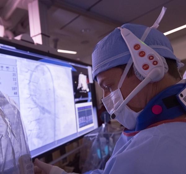 Closeup of cardiologist examining screen during procedure