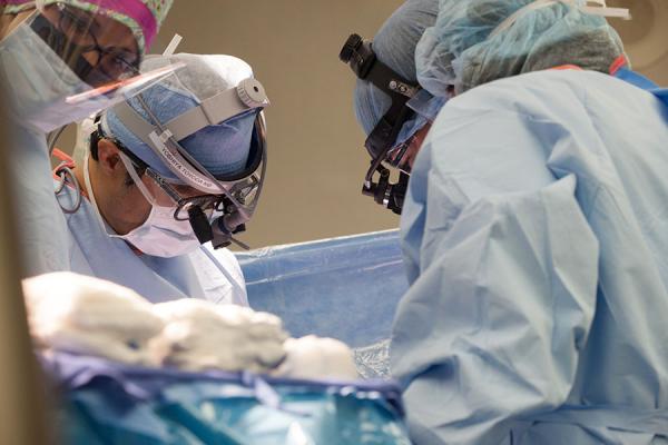 Dr. Yoshiya Toyoda performing heart transplant surgery