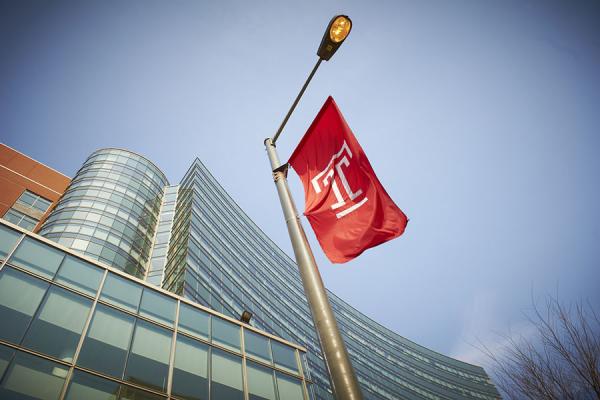 Temple flag in front of Medicine Education Research Building